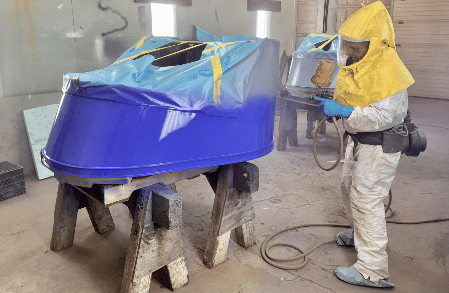 Ed Lesowski paints a Whip car