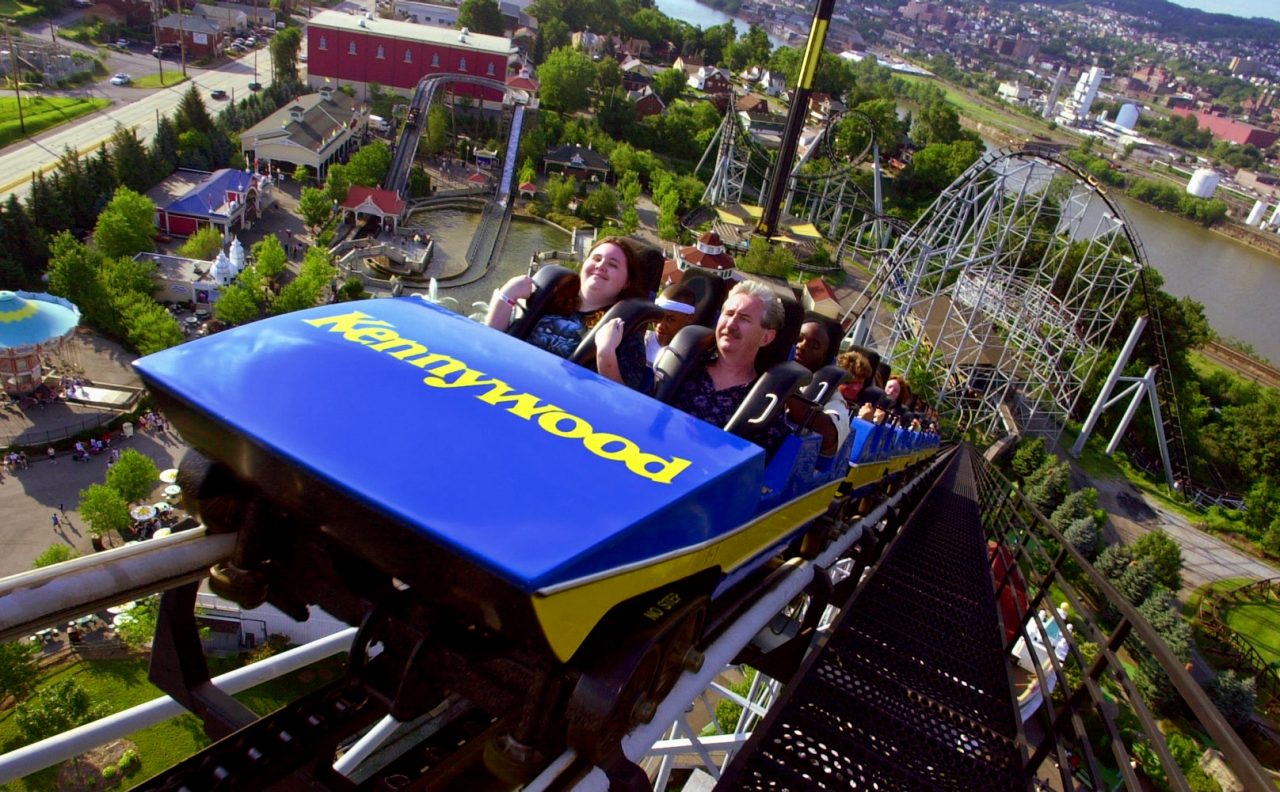 The Steel Phantom at the top of the lift hill, with Lost Kennywood in the background.